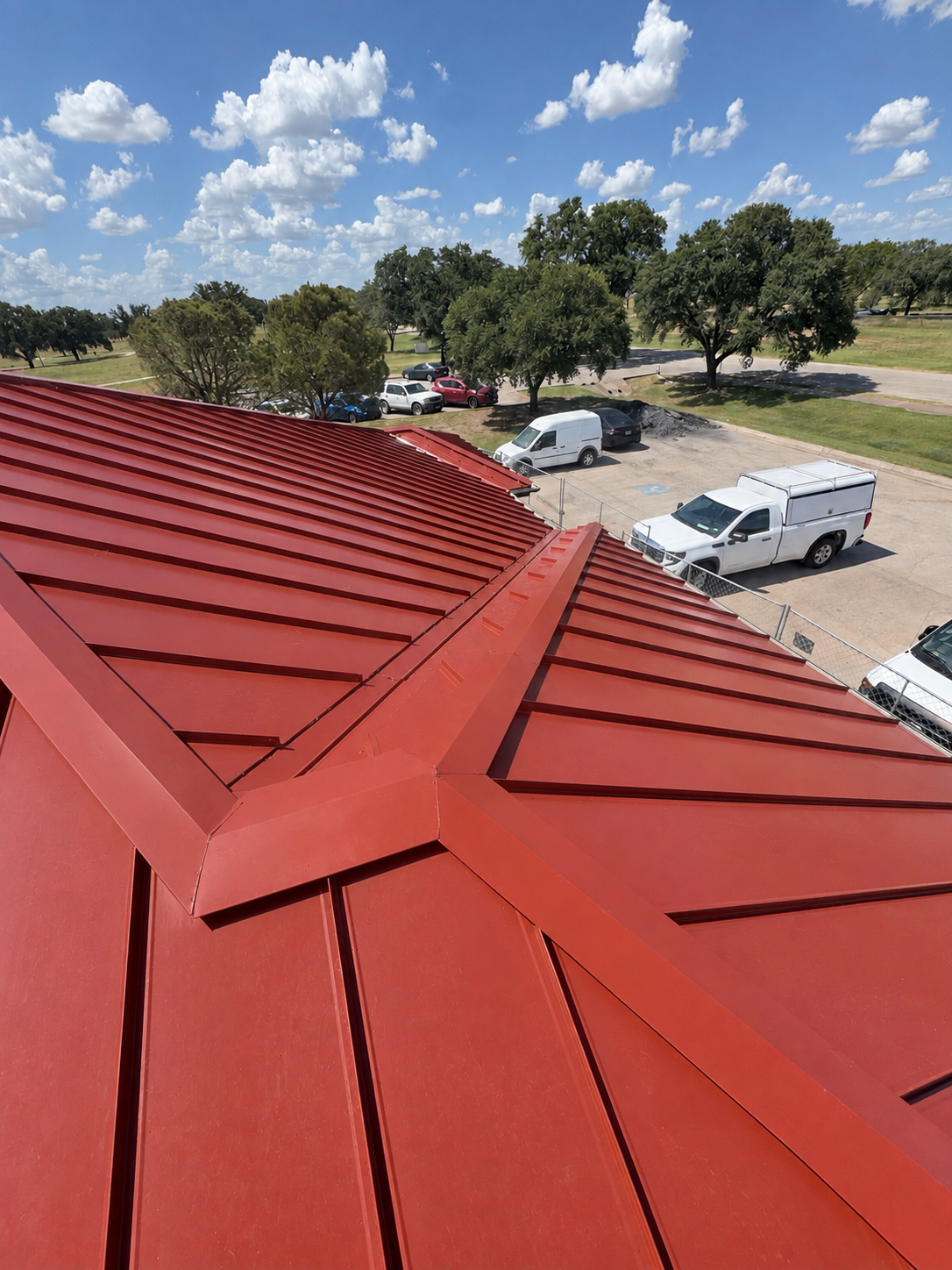 Red standing seam roof ridge detail