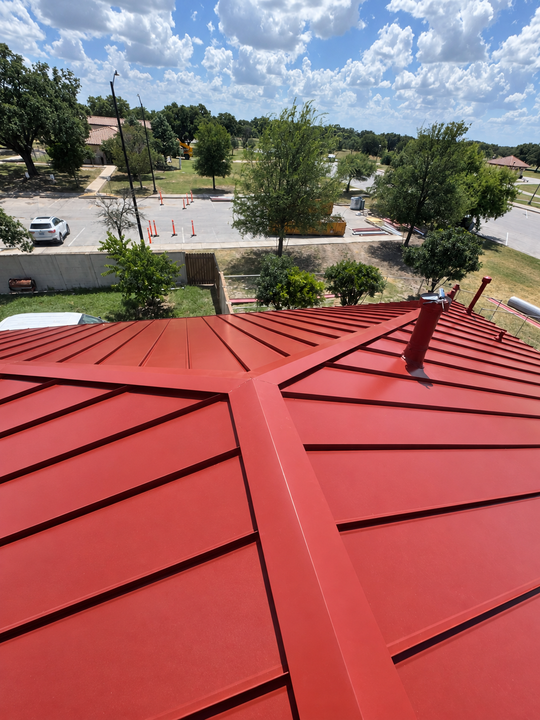 Red standing seam roof with vent detail