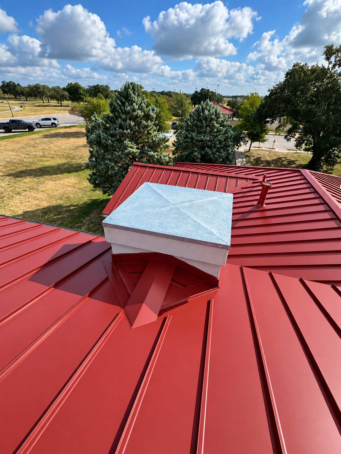 Red standing seam roof curb detail